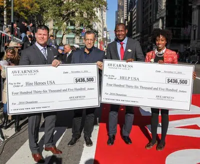 Kenneth Cole, Chairman and Chief Creative Officer of Kenneth Cole Productions, awarded Brian Stann, President and CEO of Hire Heroes USA and Marine combat veteran, and HELP USA's Jahmila Vincent, Program Director at HELP Hollis Garden Apartments, and Linson Baily Alexander, Executive Director of HELP USA's National Supportive Services for Veteran Families, with their donation checks. Kenneth Cole, Chairman and Chief Creative Officer of Kenneth Cole Productions, awarded Brian Stann, President and CEO of Hire Heroes USA and Marine combat veteran, and HELP USA's Jahmila Vincent, Program Director at HELP Hollis Garden Apartments, and Linson Baily Alexander, Executive Director of HELP USA's National Supportive Services for Veteran Families, with their donation checks.