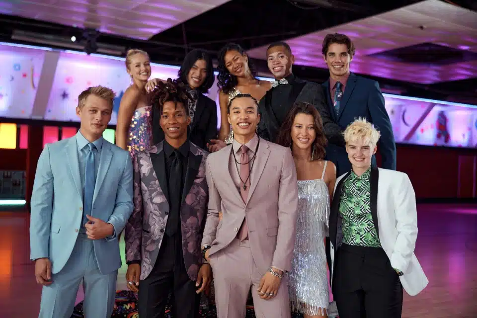 Ten young people standing in prom attire